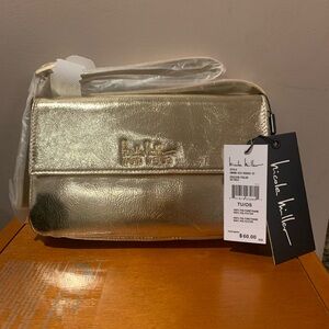 NWT. Nicole Miller Crossbody. Gold in color. Approx 9x6x2